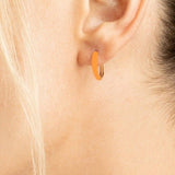 These 14K Gold Earrings are part of the Hoop Collection and feature a sophisticated combination of shiny polished metal and neon orange enamel. Perfect as a gift, these 11x2mm gold hoop earrings are sure to be an eye catching statement piece. Crafted by Diamond Origin, they are an elegant and fashionable addition to any jewelry collection.  gift for her, birthday gift, gold gift, love gift,  Elegant and fashionable gold earrings, trendy gold earrings for all occasions gifts,