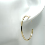 our gold hoop earrings are made from the highest quality materials, ensuring that they're durable, long-lasting, and resistant to wear and tear. Whether you're wearing them to a special event or for everyday wear, you can trust that these earrings will maintain their shine and luster for years to come.