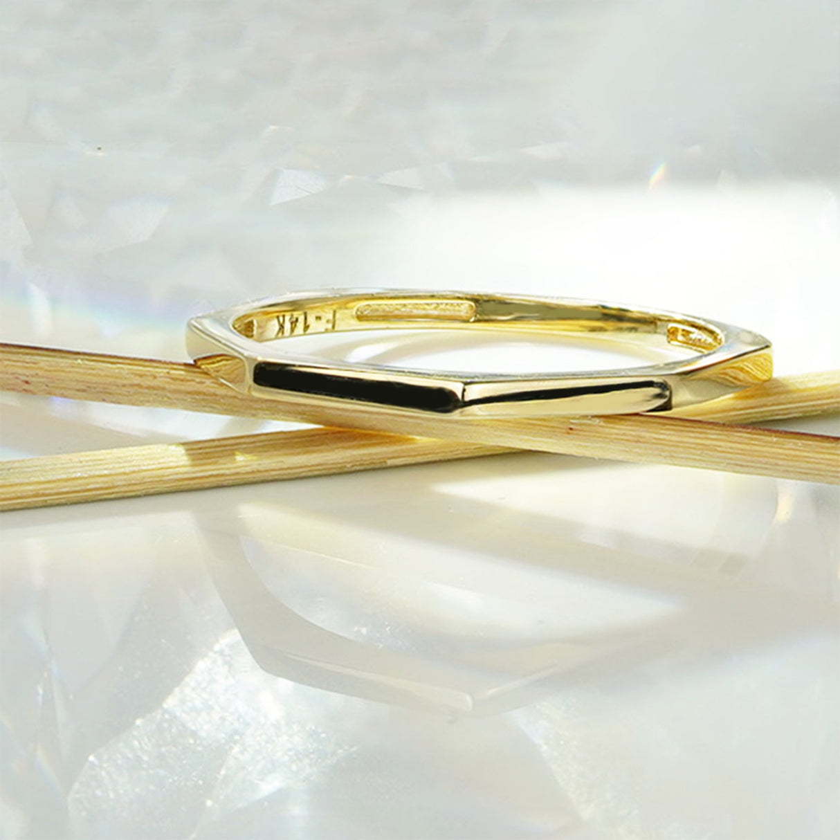 This elegant and stylish 14K gold geometric ring is perfect for any occasion. Its unique design and intricate details interlock perfectly to create an eye-catching stackable ring. Each detail is carefully crafted using 14k gold. Its stackable design makes it a great addition to any jewelry collection.