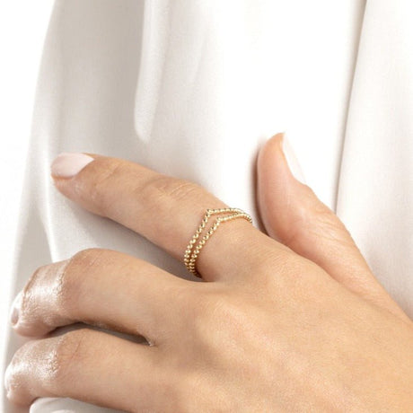 Double beaded ring, Chevron design ring, Gold ring, Statement ring, Fashion ring, Jewelry gift, Elegant ring, Sophisticated ring, Women's ring, Handcrafted ring, Fine jewelry, Luxury ring, Unique ring, Fashion accessory, Trendy jewelry. 14K Gold Ring, Double Beaded Chevron Design, Unique design, Eye-catching, Lustrous finish, Versatile accessory, Dressed up or down, Comfortable, Lightweight, Everyday wear, Durable construction, Elegant, Sophisticated, 
