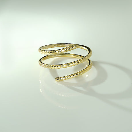 The Diamond Origin Ribbed Texture Wrap Ring is crafted from 14k gold, making it a luxurious, modern accessory. With its elegant, fashionable design, this piece is sure to make a statement. The unique ribbed texture will add a touch of texture and style to any of your look.