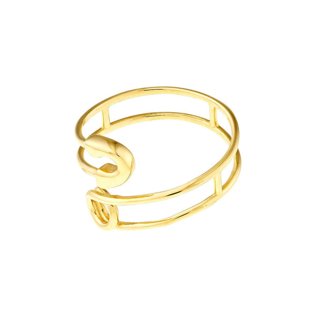 The 14K Gold Safety Pin Bypass Ring captured in natural light, accentuating the exquisite craftsmanship, the playfulness of the safety pin design, and the allure of gold